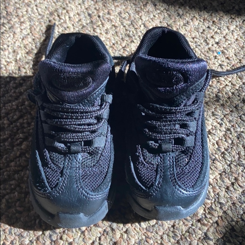 Black pair of all black air max sneakers l.